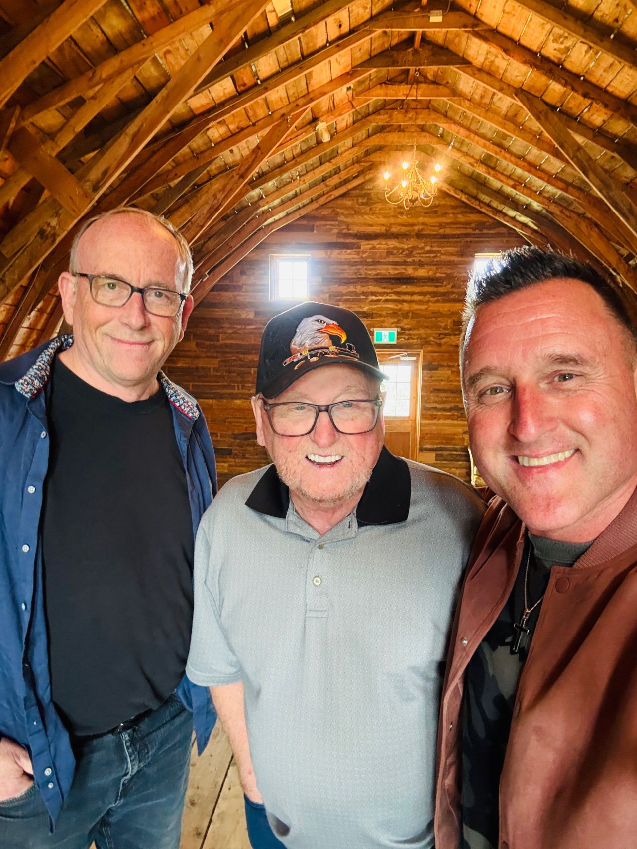 Three members inside the barn